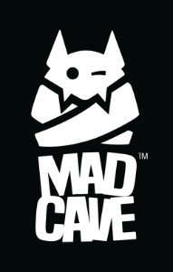 The Mad Cave Studios Logo. Depicts a logo made of cut out shapes showing a cute bat or similar creature in a straight jacket, with their head poking out. They have tall ears and little fangs, with one eye winking. Under the character is the text MAD CAVE, with the letters slightly jumbled out of alignement.